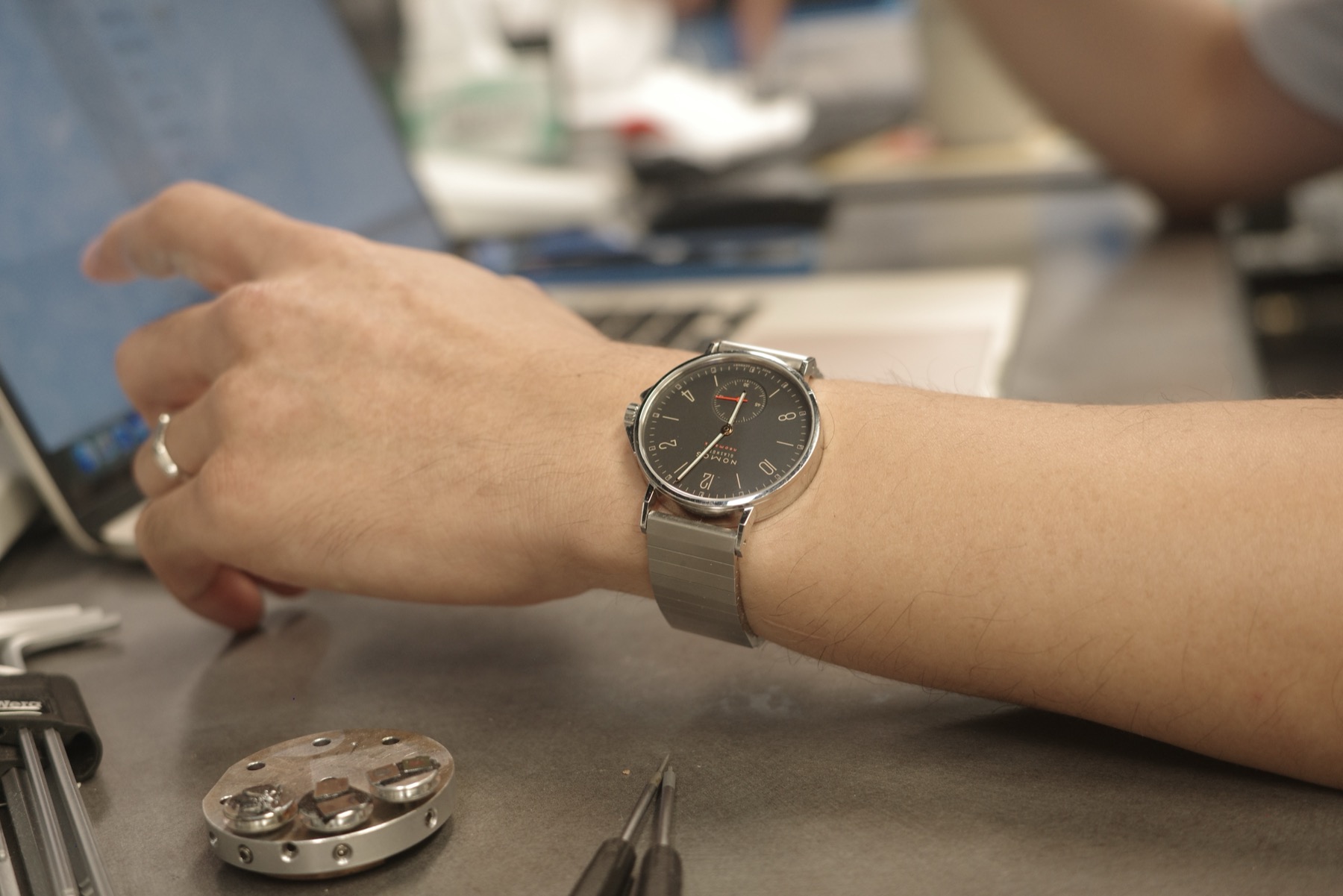 Bracelet on the desk with a caliper nearby